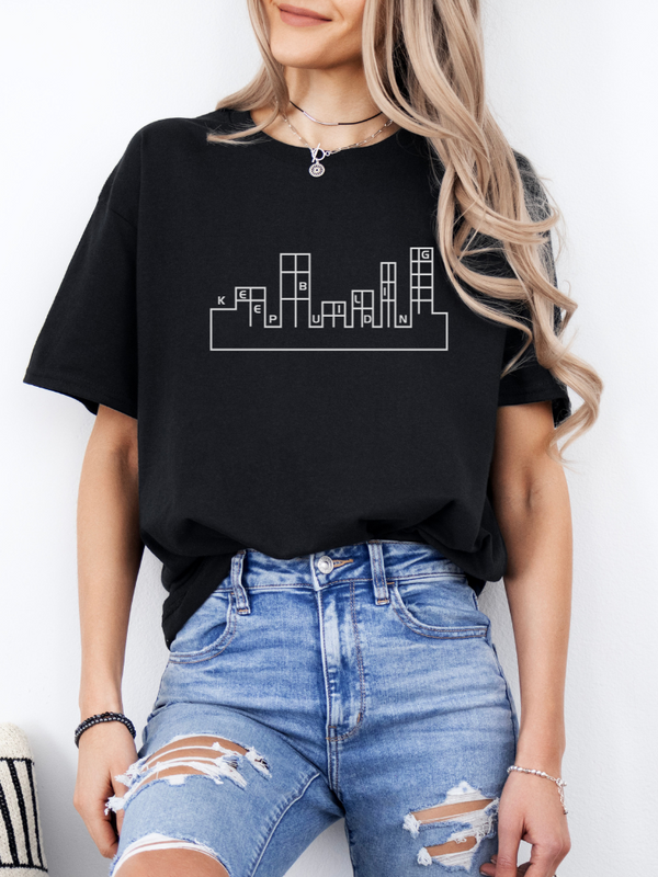 Mockup showcasing a women's T-shirt with a KB-themed design, presenting a trendy and stylish appearance.